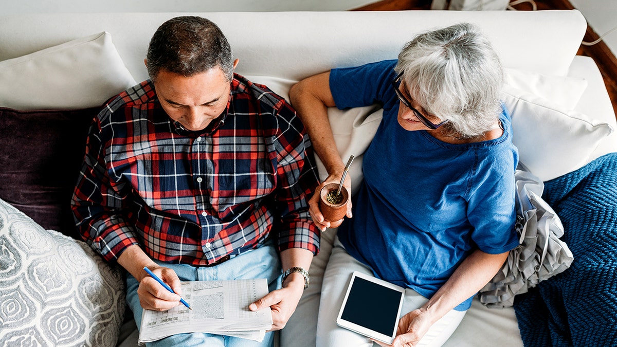 Couple doing crosswords - brain health