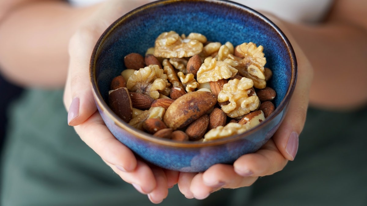 Woman holding mixed nuts